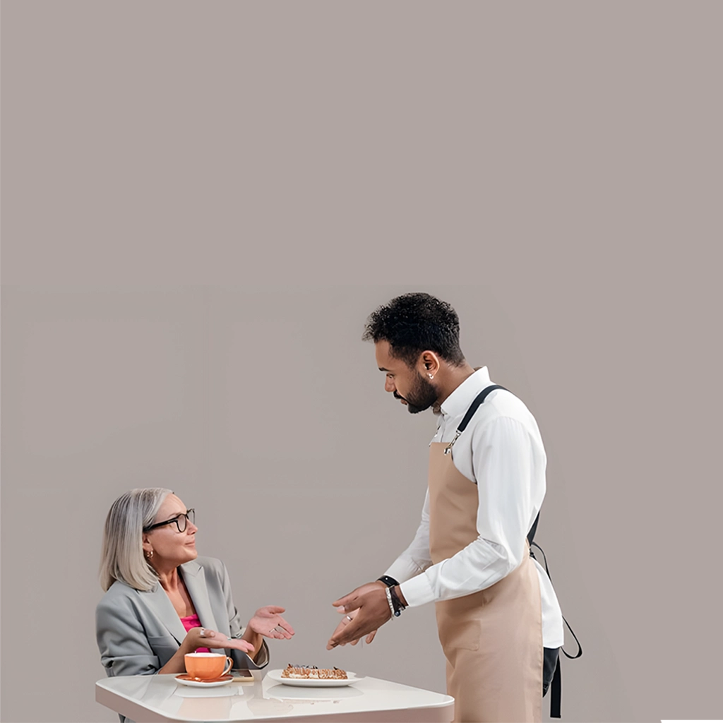 Gast und Servicemitarbeiter befinden sich in einer klärenden Gesprächssituation über ein Gericht und zeigen praxisnahe Beispiele für professionelles Beschwerdemanagement im Service.